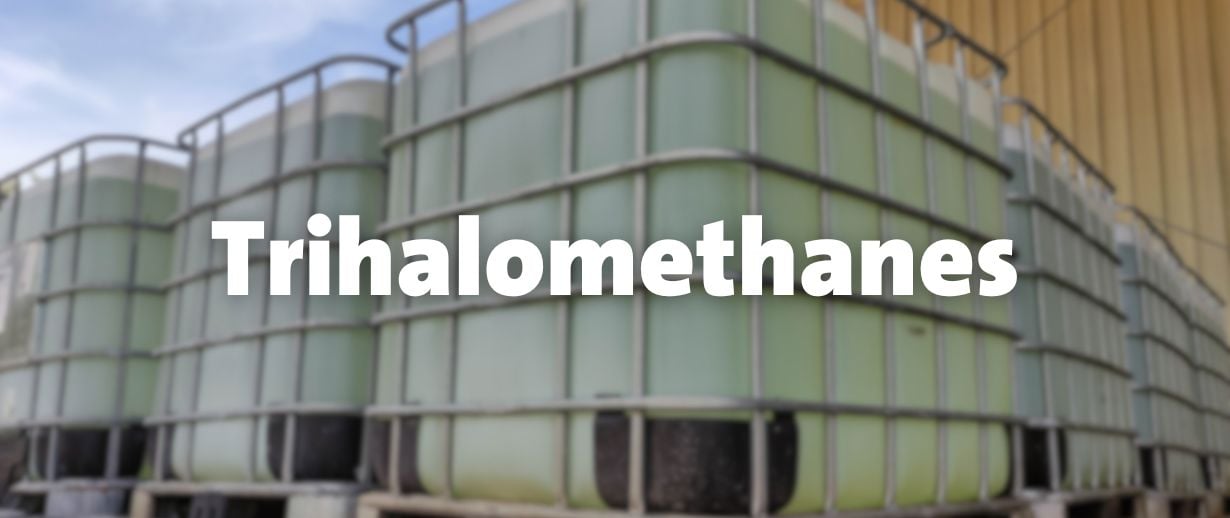 Text saying Trihalomethanes in front of large chemical containers.