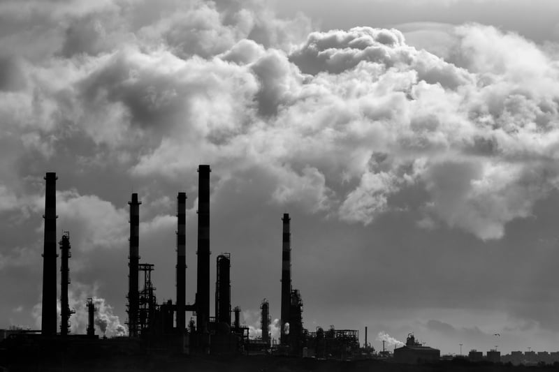 A petrochemical refinery against rain and storm clouds