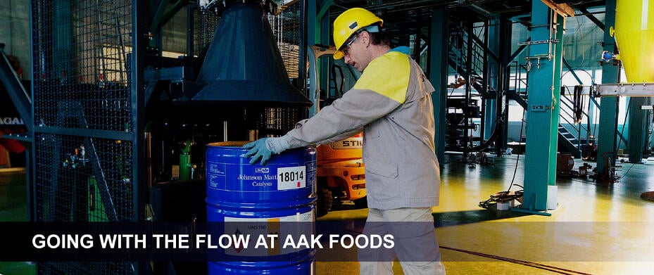 Water Treatment technician handling a barrel of water treatment chemicals