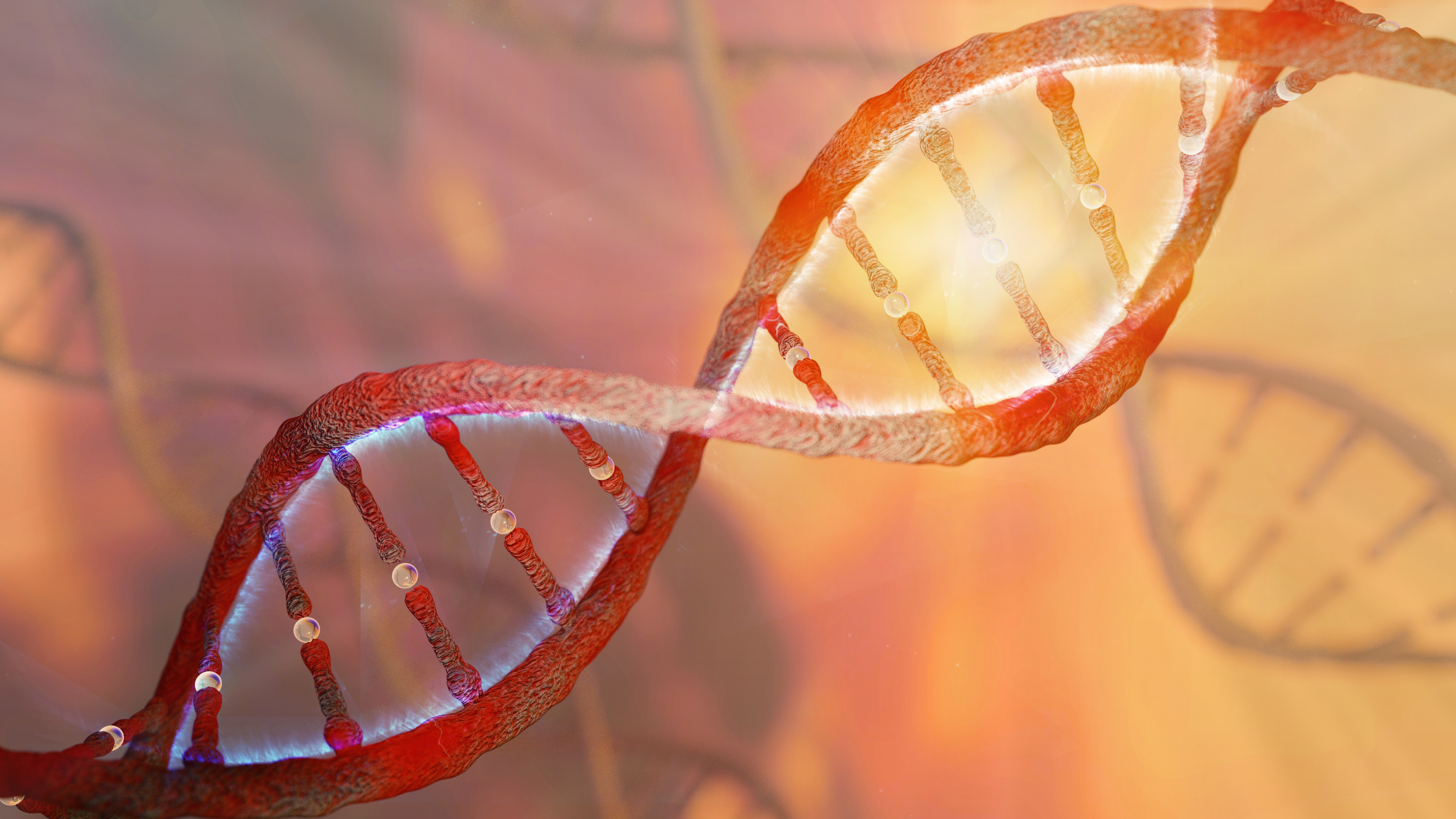 A DNA double helix on an orange background with light shining through