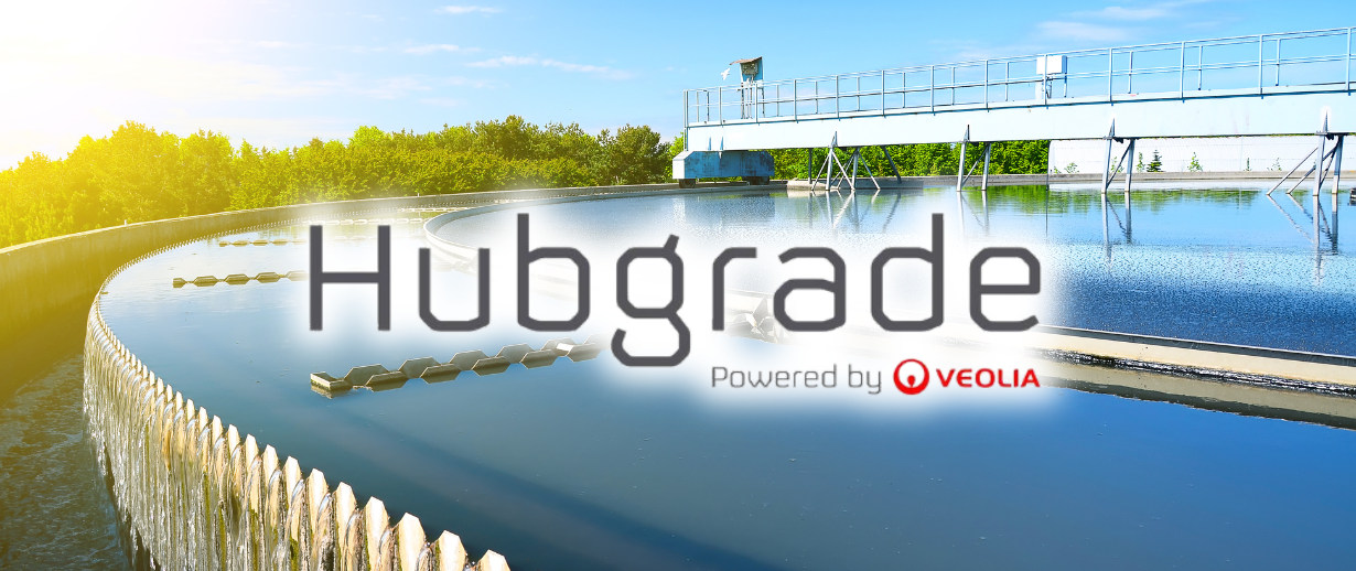 A wastewater treatment plant on a sunny day with the words 'Hubgrade Powered by Veolia' laid acorss the top.