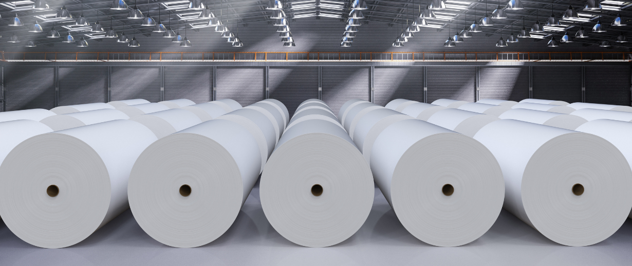 Large white paper rolls in a clean warehouse